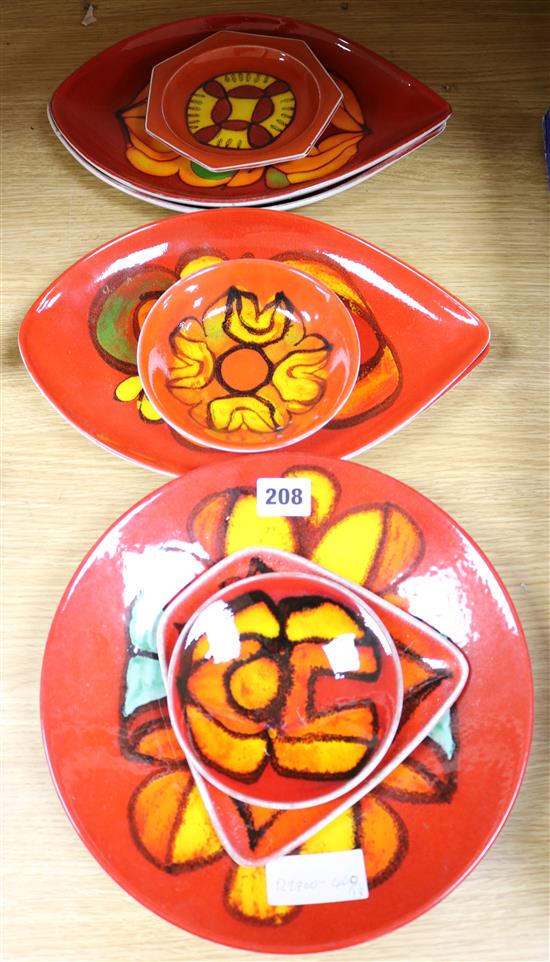 Nine Poole Pottery Delphis red ground dishes including four shape 91s.